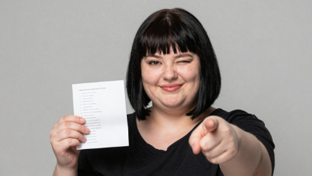 winking and smiling woman holds sr22