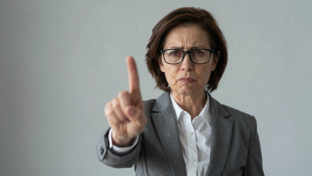 woman holds up finger says no